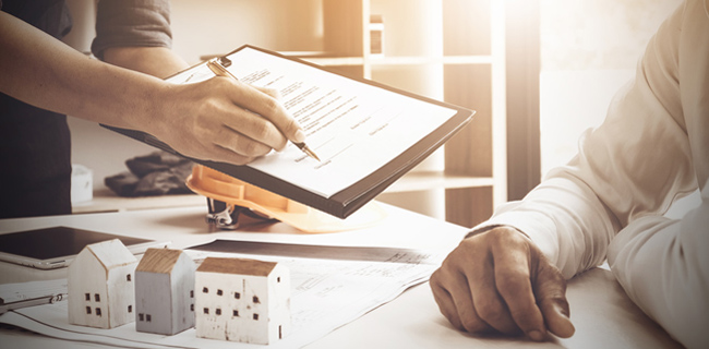 Leaving Anything Important Out of Your Property Sale Agreement Will Sink It close up of business man pointing and signing agreement for buyi